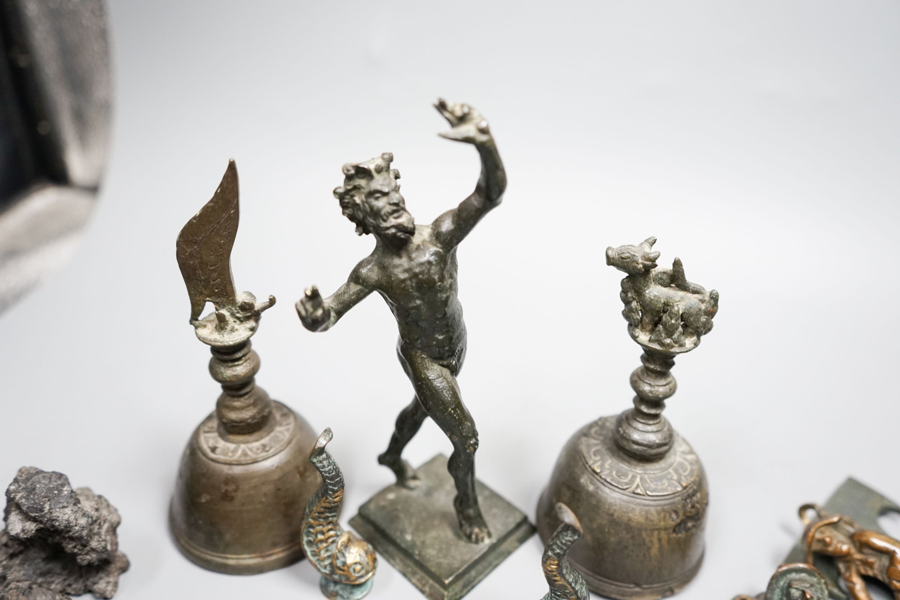 A small quantity of decorative metalware, including two bronze table bells, a bronze faun, 17cm, pewter spoons, etc.